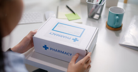 Workforce group health care unbox open Rx mail covid first aid kit drug box self cure. Asia people...
