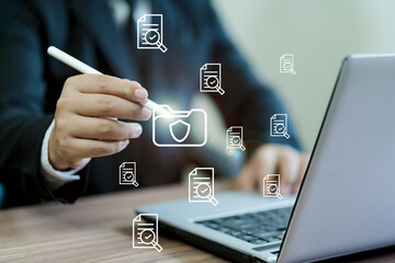 Businessman's hands checking items on documents to manage data recording system concept of document...