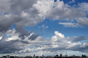 Skytree can be seen in the distance, with a variety of clouds spreading in the blue sky above the...