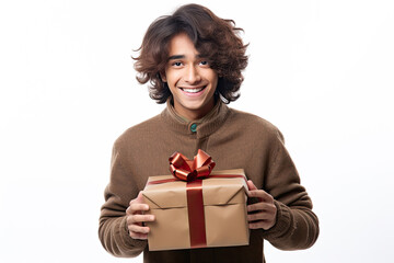 Fototapeta premium Portrait of a happy Indian teenager receiving a gift box, on a plain white background
