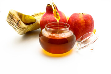 Shofar (horn), honey, apple  and pomegranate jewish traditional symbols .Shofar , honey, apple and...