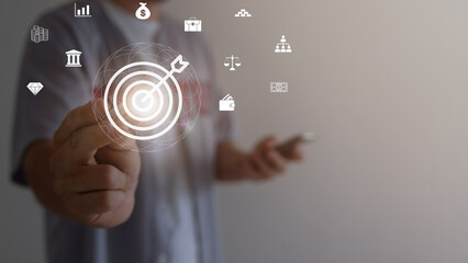 Digital marketing. Businessman touching darts aiming at the target center with icon network connection. Business goal and technology concept.