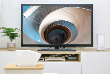 Watching and streaming TV and movies, abstract concept, first-person perspective, TV screen in background showing spiral staircase down the rabbit hole, modern living room interior.
