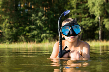 Weekends in nature with family, child in underwater diving mask