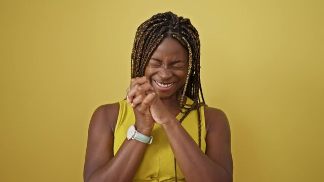 African american woman pointing herself celebrating over isolated yellow background
