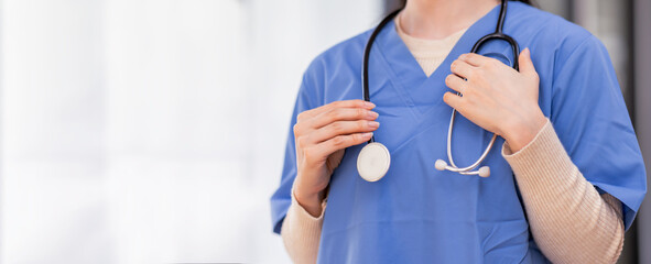 Close up of a professional female doctor, nurse in uniform with a stethoscope, isolated on white...