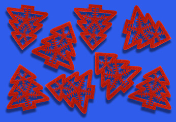decorative red felt Christmas trees on a blue background. new year celebration concept.