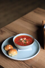 Traditional Ukrainian Russian borscht . Bowl of red beet root soup borsch with white cream . Beet Root delicious soup . Traditional Ukraine food cuisine