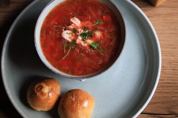 Traditional Ukrainian Russian borscht . Bowl of red beet root soup borsch with white cream . Beet Root delicious soup . Traditional Ukraine food cuisine