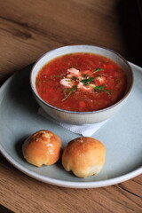 Traditional Ukrainian Russian borscht . Bowl of red beet root soup borsch with white cream . Beet Root delicious soup . Traditional Ukraine food cuisine