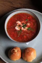 Traditional Ukrainian Russian borscht . Bowl of red beet root soup borsch with white cream . Beet Root delicious soup . Traditional Ukraine food cuisine