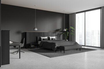 Dark home bedroom interior with bed and workspace, panoramic window
