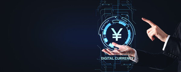 Businessman hand with yen or yuan sign and digital currency hologram copy space