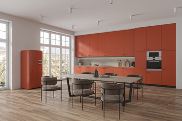 Orange home kitchen interior with dining and cooking space, panoramic window