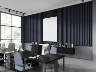 Blue and gray open space office corner with poster
