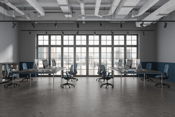 Gray and blue open space office with window