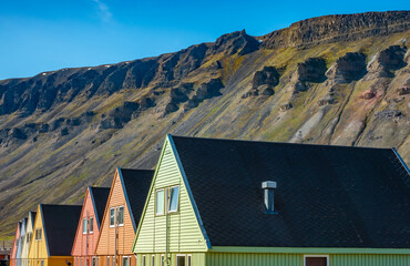 Colorful old coal mining houses on the hills of Longyearbyen, the world's northernmost settlement, Spitsbergen, Svalbard, Norway