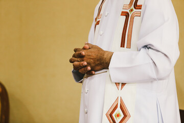 Hands of the priest during the celebration of the Holy Communion.