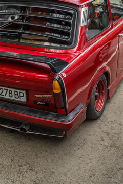 Red Trabant 601 on the parking lot in the city