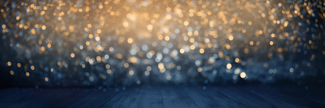 Background with dark blue wooden base and bokeh golden lights