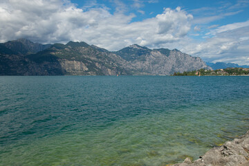View of beautiful beach of Lake Garda near the small town of Malcesine in Veneto