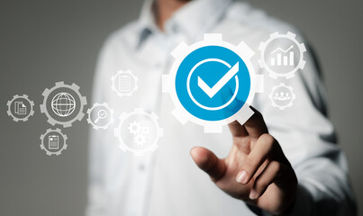 Businessman touches quality assurance icon, ISO standard guarantee, Quality assurance control...