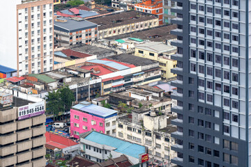 Fototapeta premium View of Kuala Lumpur from the upper floors of the skyscraper on cloudy day. Malaysia.