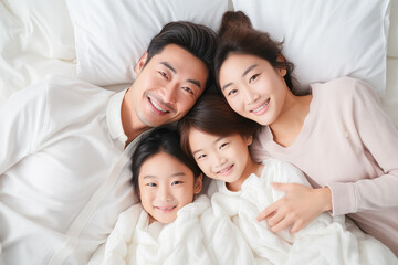 Fototapeta premium family, mother, father, bed, daughter, home, love, bedroom, happiness, lifestyle. close up to happy family and childhood on bed at home. everyone put on white pajama. everyone smile be honest