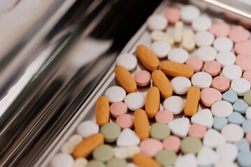 Macro Shot of colour Pills and Capsules During Production and Packing Process on Modern...