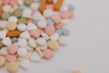 Macro Shot of colour Pills and Capsules During Production and Packing Process on Modern Pharmaceutical Factory. Tablet and Capsule Manufacturing Process. Close-up Shot of Medical Drug Production Line.