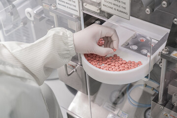 Macro Shot of colour Pills and Capsules During Production and Packing Process on Modern...