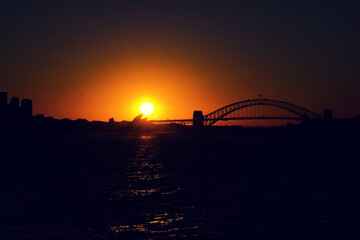 Sunset view of Sydney harbour taken from the Manly Ferry while travelling away from Port Jackson on thr Pacific Ocean