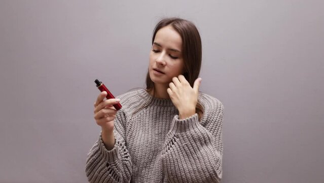 stop vape, refusal of disposable cigarettes, quit smoking teenager, teen girl looks at a ecigarette