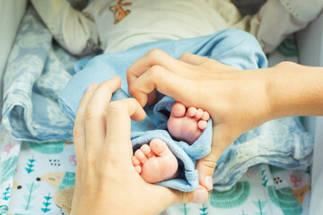 little baby legs in arms