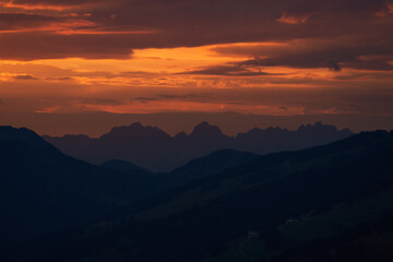 mountain silhouette with a beautiful orange sunset 