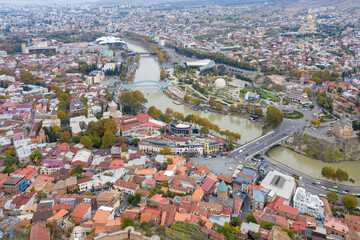 Aerial view of Old Town; Kura river and Rike Park on cloudy autumn day. Tbilisi, Georgia.