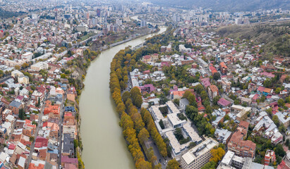 Aerial view of Tbilisi and Kura river on cloudy autumn day. Georgia.