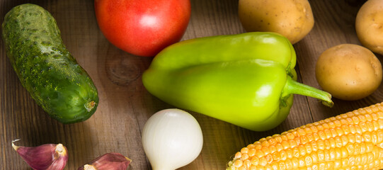 vegetables on a wooden table. Wide photo.