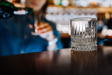 bartender hand making cocktail in bar