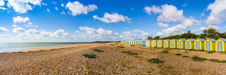 Colorfool beach huts on the shores of Littlehampton Long Beach in Sussex, England, UK; wooden...