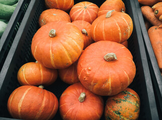 Box with pumpkins at the market close up