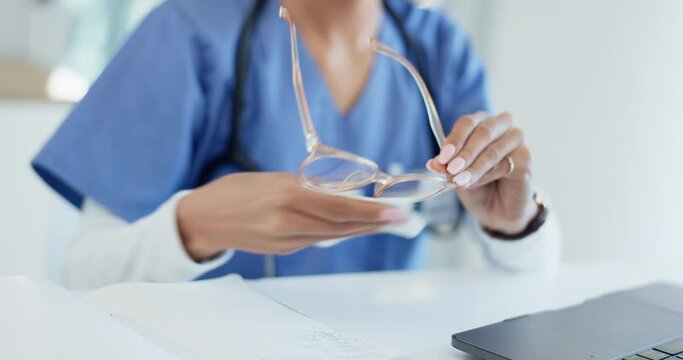 Hands, person cleaning glasses and vision with eye care, wellness and health, hygiene and fabric to wipe. Closeup, optometry and healthcare with medical professional, eyewear maintenance and cloth