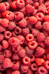 A raspberry background is a delightful burst of vibrant red and juicy freshness