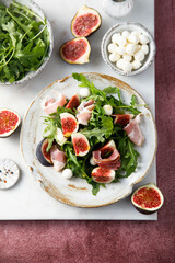 Arugula salad with figs and mozzarella cheese