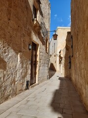 Fototapeta na wymiar Narrow street of the fortified city of Mdina in Malta