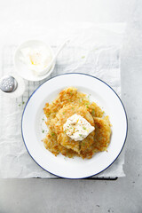 Homemade potato latkes with cream cheese