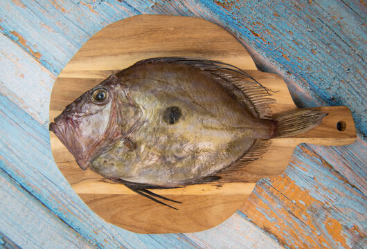 Saint-Pierre Seafish, Zeus Faber, John Dory, Pez de San Pedro, fish, isolated on cutting board background. High quality photo