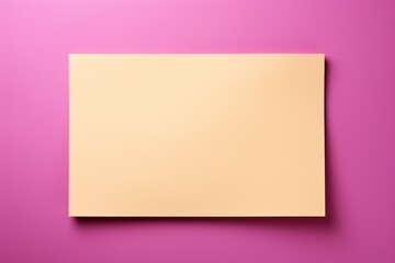 Blank white paper on a bright yellow backdrop, ready for your creativity