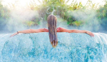 Woman relaxes in basin of natural termal spa- health care, wellness,relax