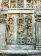 A Charming Sculpture carvings of Hindu Goddesses and Dancers on the exterior walls of 'Chennakeshava'stone temple in Karnataka, India.